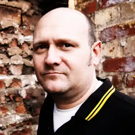 Daniel Kennedy, Creative Director and founder of Paper Films, on location during a corporate brand film shoot in Manchester